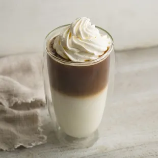a cup of coffee with whipped cream