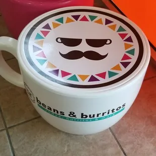 a bowl of beans and burritos