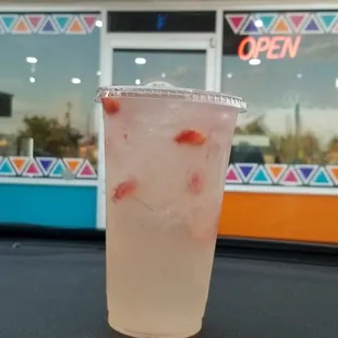 a drink in a plastic cup