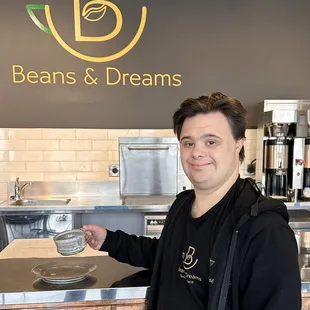 a man standing in front of a counter