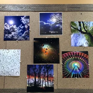  cork board with pictures of trees, clouds, and sun
