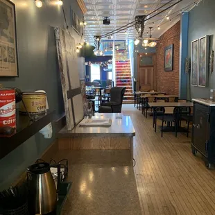 a coffee shop with tables and chairs