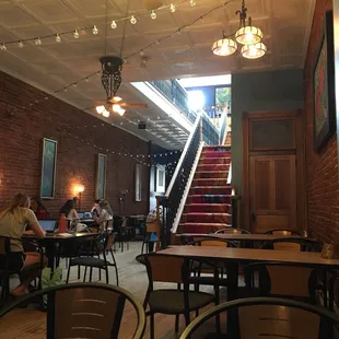 people sitting at tables in a restaurant