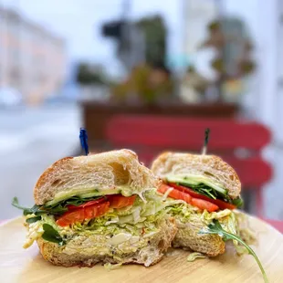 Egg Salad Sandwich w/ swiss cheese, lettuce, tomato, cucumber, arugula | $12.99