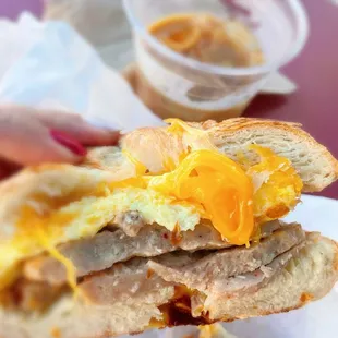 Cragel Sando - cross section. Cheese, eggs, and sausage.