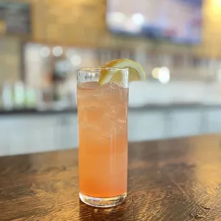 a drink with a lemon slice on the rim