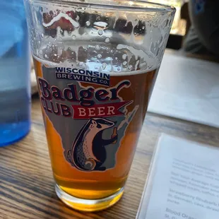 a glass of beer on a table