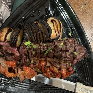 Charred potato and raw hanger steak