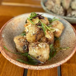 Crispy Rice w/ thai chili, nước chấm, shiitake pickles, coconut ($22)