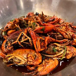 a bowl of cooked lobsters