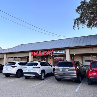 cars parked in front of the restaurant