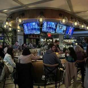 people sitting at the bar