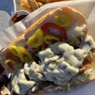 Steak &amp; Cheese Sandwich with Banana Peppers and a side of Cajun Fries