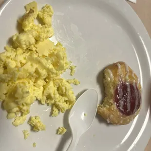 Another breakfast scrambled eggs with cheese danish. Only a plastic spoon to eat with.
