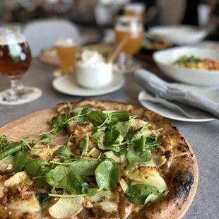 a pizza on a wooden board