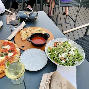 pizza and salad on a table
