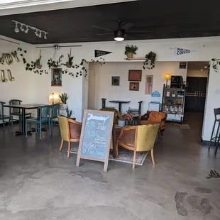 seating area with plants on the wall
