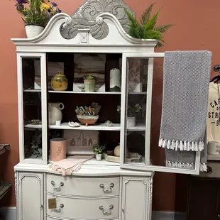 a white china cabinet