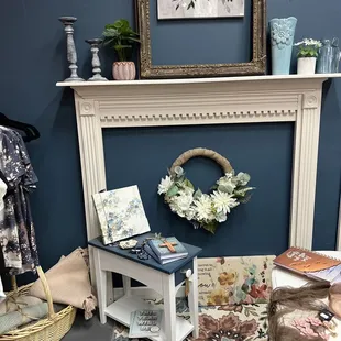 a room with a fireplace and a wreath