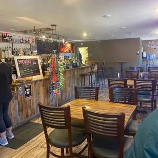 a woman standing at the bar