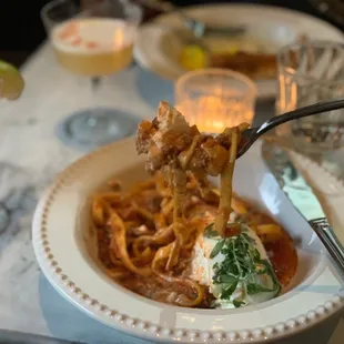 a plate of spaghetti with a fork