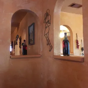 a wall with two arched windows