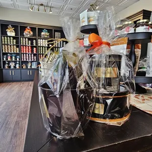 a bear in a bag and a bottle of wine on a table