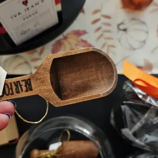 a person holding a wooden spoon