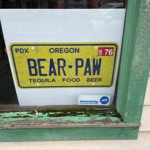 a license plate in a window