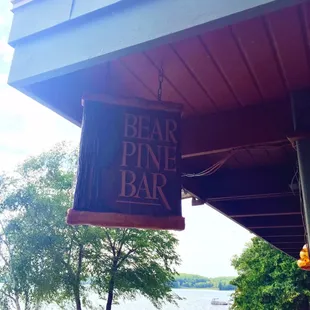 a sign hanging from the side of a building