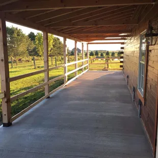 a porch with a fenced in area