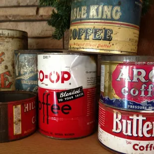 a variety of coffee cans