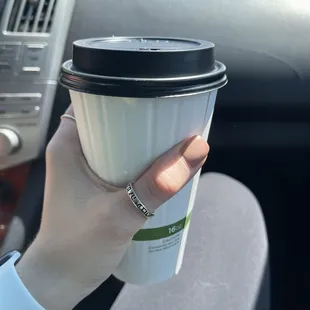 Small coffee with a splash of almond milk