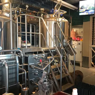 a row of stainless steel tanks