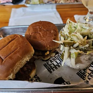 Brisket slider, pork belly slider, cole slaw.