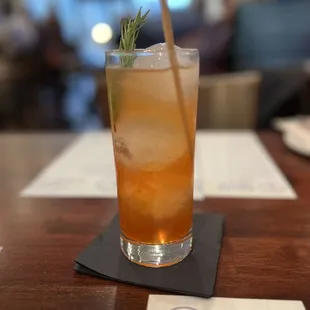 a drink on a table with a straw