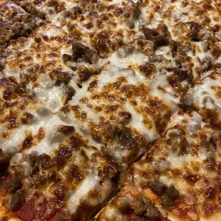 Sausage, onion, and extra cheese cut tavern-style.