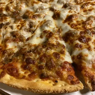 Sausage, onion, and extra cheese.