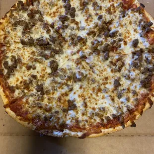 Large sausage, onion, and extra cheese cut traditionally. Large pizzas are cut tavern-style here unless requested otherwise.