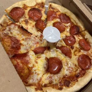 a pepperoni pizza in a box
