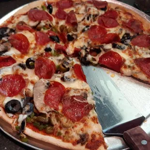pepperoni, mushrooms, olives, and cheese