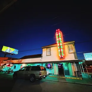 the neon sign for the restaurant