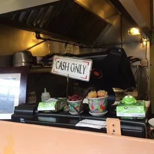 Cash only! ATM across the plaza at the Gyros shop :)