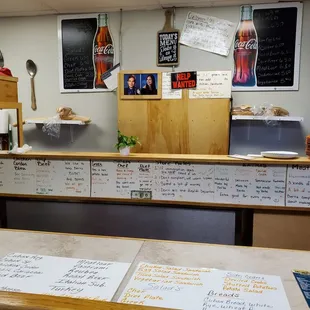April 2020: Sandwiches prepared in front of the HELP WANTED sign.