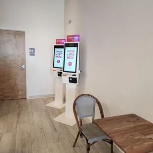 Lobby area near bathroom with kiosks