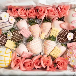 Deluxe dipped strawberries, hot cocoa bombs, and fresh roses.