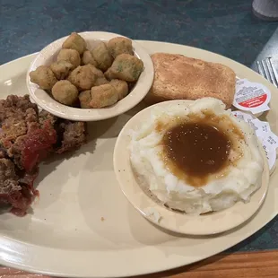 Meatloaf is delicious with mashed potatoes and gravy, fried okra and cornbread. $8.99. Well worth it.