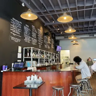 Bar area &amp; menu written on the wall.