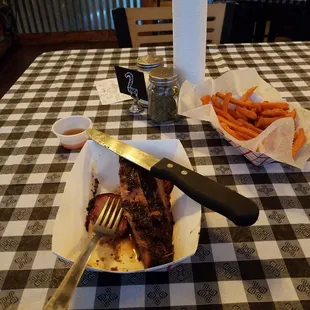 1/2 pound of brisket and sweet potato fries. I couldn't wait to dig in so some of it is missing.