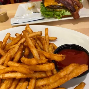 Bacon burger and table fries.